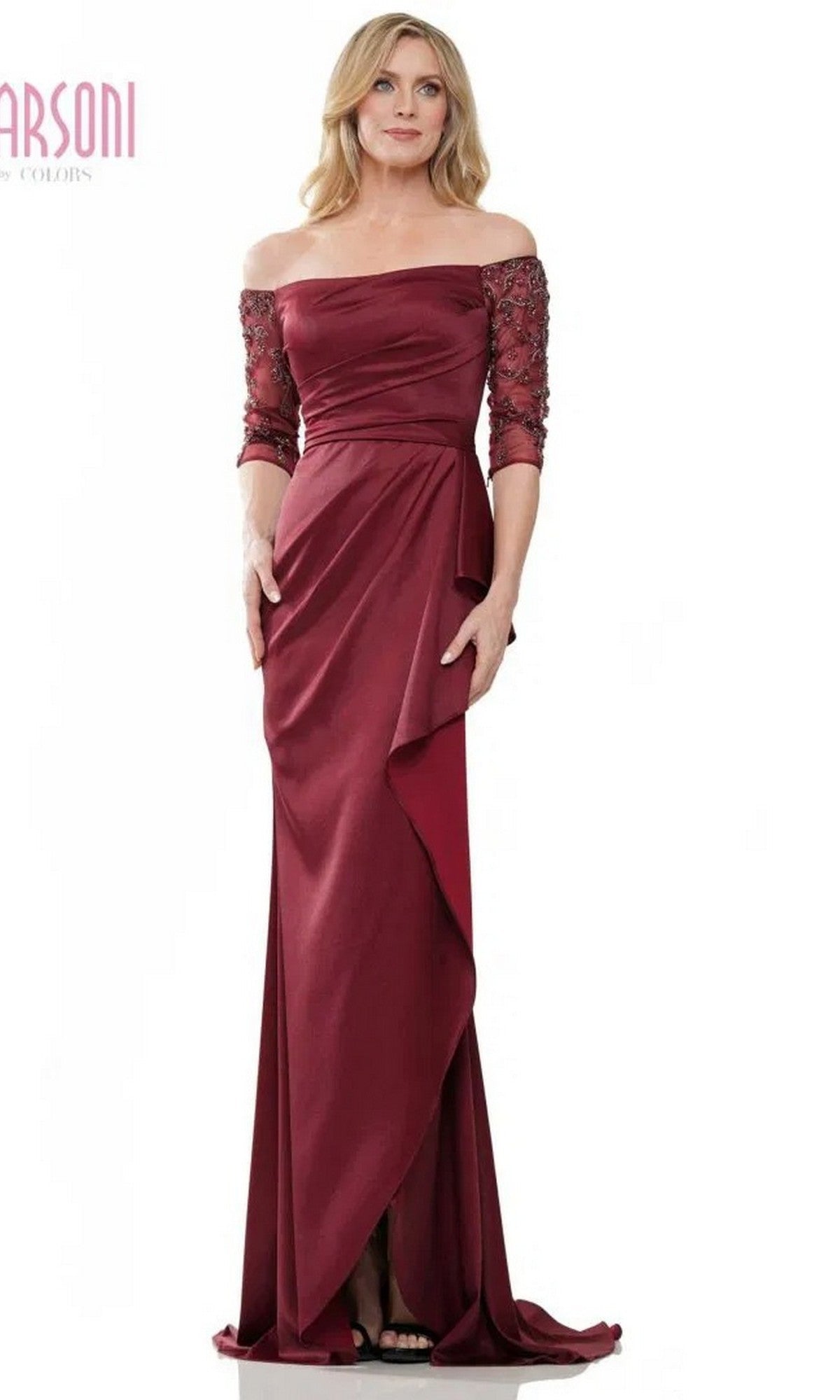A woman stands facing forward in a floor-length Marsoni MV1254 long formal dress—an off-the-shoulder gown in wine with lace half sleeves.